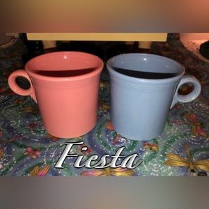 Two vintage Fiesta mugs, pink and blue